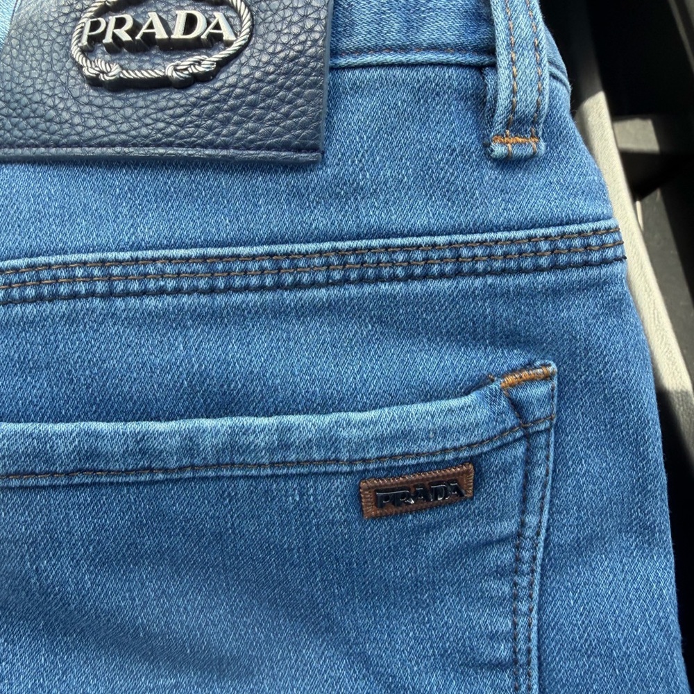 Size 8 preowned in great condition PRADA JEANS leather and metal patch RARE